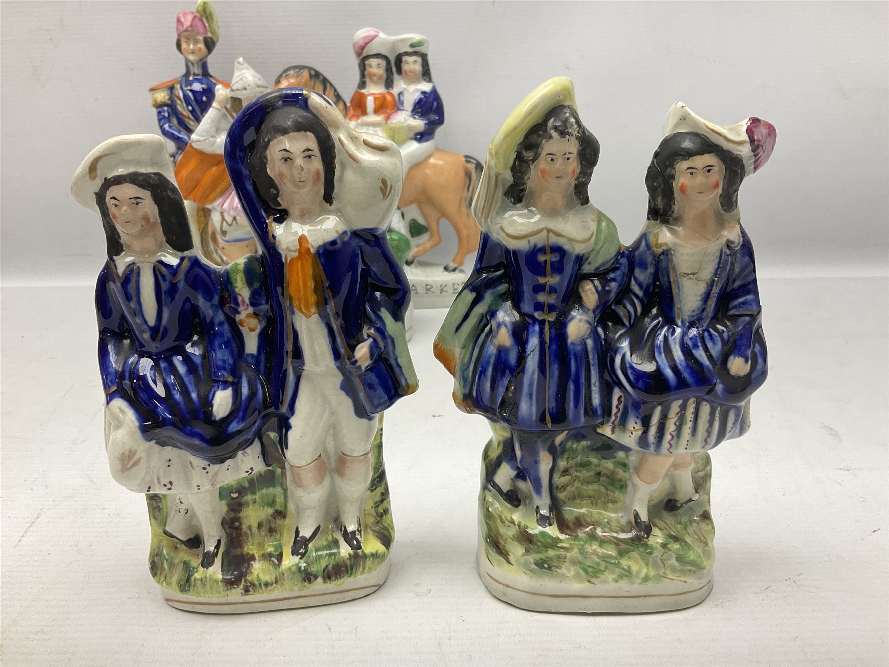 Quantity of Victorian and later Staffordshire style figures, to include examples upon horseback, sheep, drummer etc