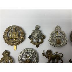Twenty cap badges including Hertfordshire, Royal Sussex, Cambridgeshire, Hampshire, Notts and Derby, East Surrey, Herefordshire, South Lancashire, Devonshire, Bedfordshire, Durham Light Infantry etc (20)