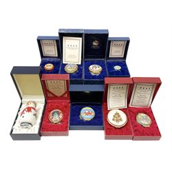 Eight Christmas themed Halcyon Days enamel boxes, and a Halcyon Days enamel bonbonniere modelled as a snowman, each in fitted box 
