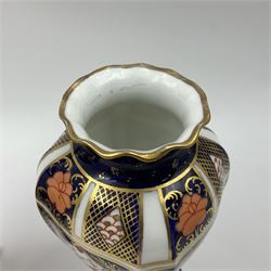 Pair of early 20th century Royal Crown Derby Imari 1128 pattern vases, of tapering straight sided form with waisted neck and frilled rim, upon four splayed feet, with printed and painted marks beneath including illustration date codes for 1911 and 1920, H17cm