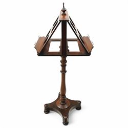 Mahogany duet music stand, twin sloped book rests on telescopic extending stem, on ring and baluster turned pedestal, shaped platform on compressed bun feet