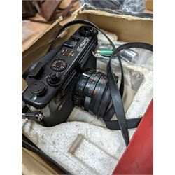 Yashica Electro 35mm film camera and a Kyocera Finecam SL400R, both boxed