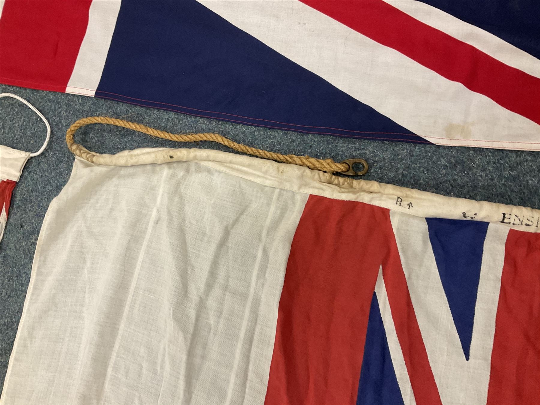 Six flags - White Ensign 180 x 86cm; two Union flags 180 x 86cm and 132 x 62cm; Falklands Islands 153 x 89cm; Yorkshire Rose 153 x 89cm; and QEII 1953 Coronation 84 x 57cm (6)