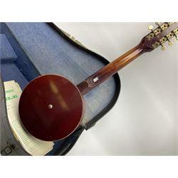 Dulcet eight-string banjo mandolin with mother-of-pearl inlaid ebonised fingerboard L55.5cm; cased; and Irish mahogany bodhran hand drum with inlaid stringing and vellum top D46.5cm; in soft carrying case with double ended beater (2)