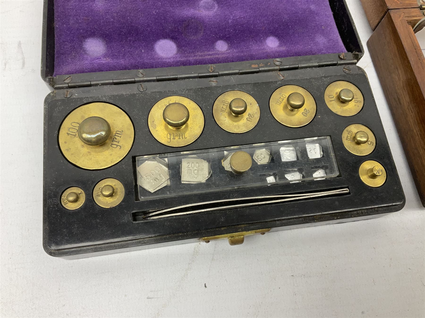 Victorian portable Sikes's hydrometer in original box, the hinged lid with inset plaque for W. & J. Burrow 62 & 63 Great Tower Street London, including ivory backed thermometer, W13.5cm; together with two bakelite cased sets of laboratory scales weights by W.J.George and Becker Ltd. and Philip Harris Ltd. (3)