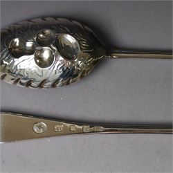 Mid 20th century silver berry spoons, each with gilt bowls embossed with fruit, with Queen Elizabeth II Coronation hallmark for C J Vander Ltd, London 1952, L22cmcm