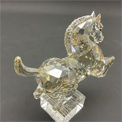 Two Swarovski Crystal Signs of the Zodiac figures, comprising horse and tiger, together with Zodiac dragon holding the flaming pearl, largest H11cm 