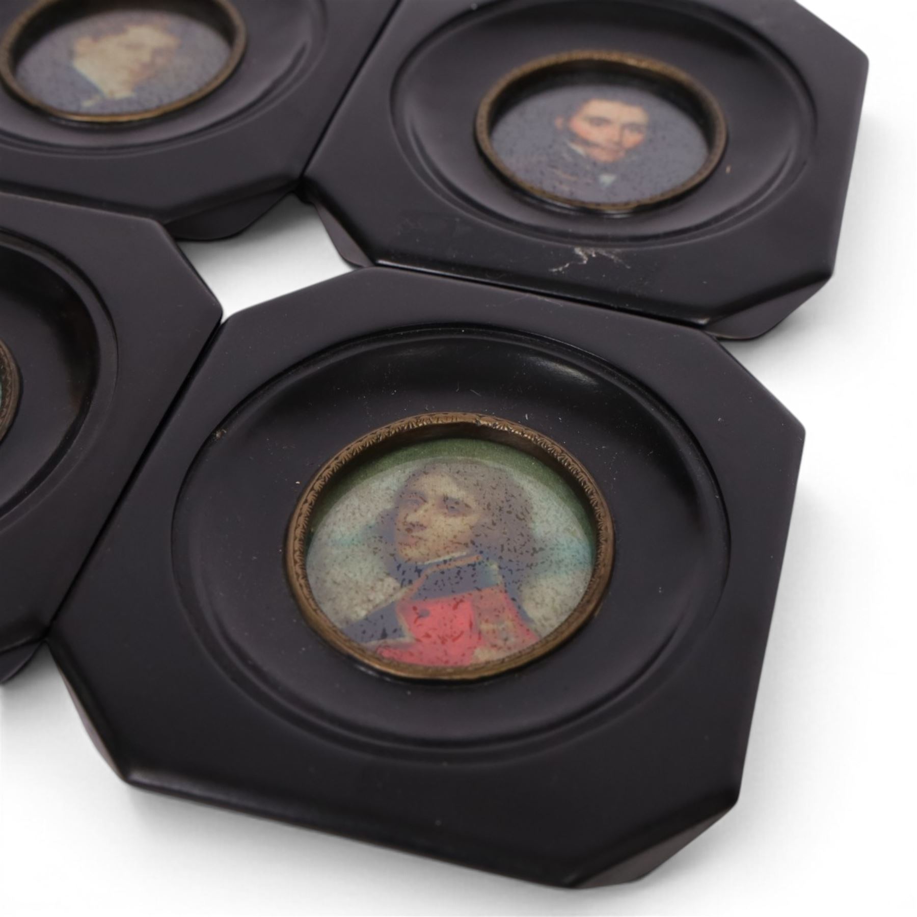 20th century four framed miniatures of gentlemen, in traditional dress, each within a black frame, H13cm