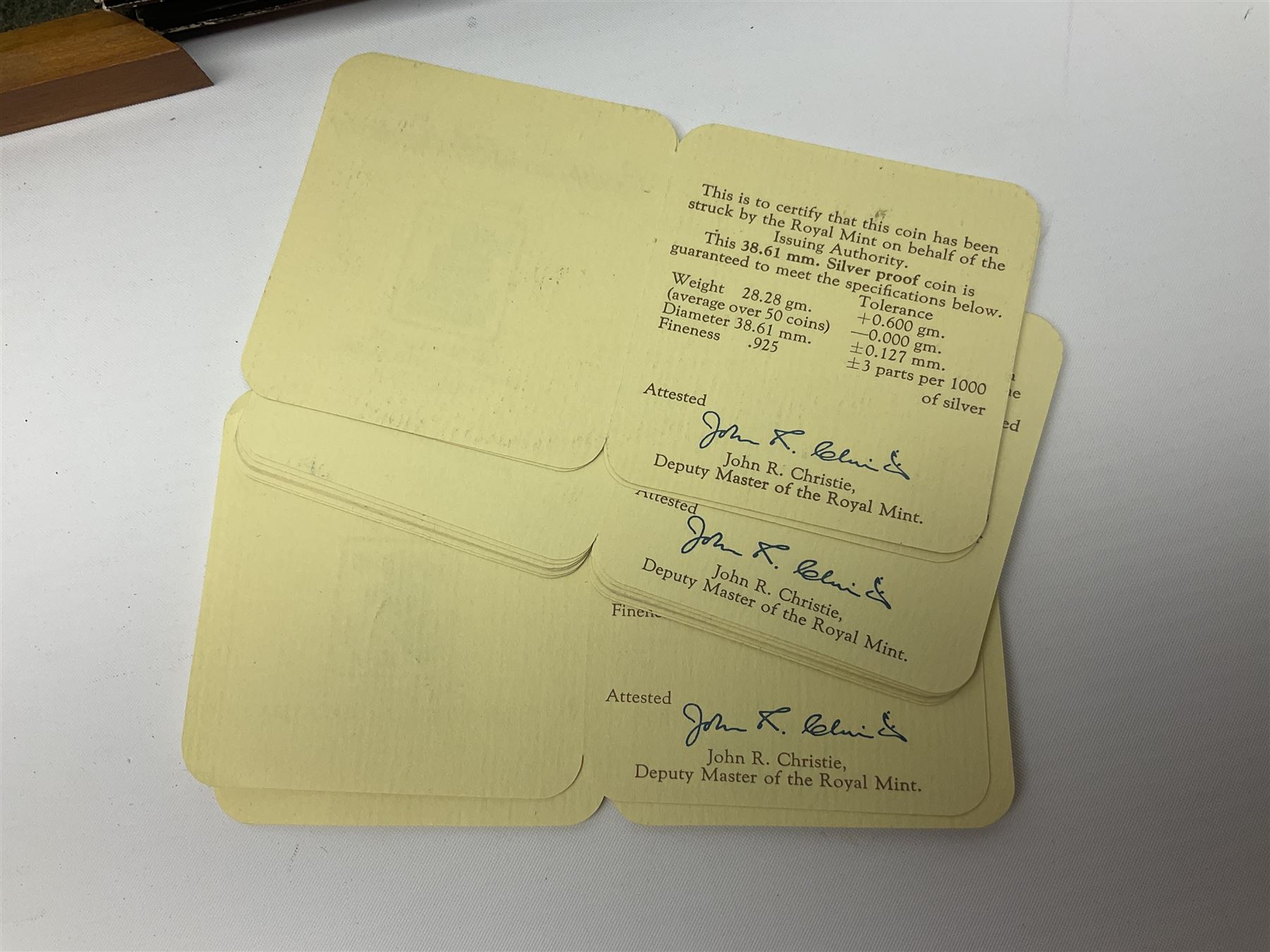 The Royal Mint 'Conservation Coin Collection' formed of twenty-four silver proof coins, housed in the wooden display case, with information booklet