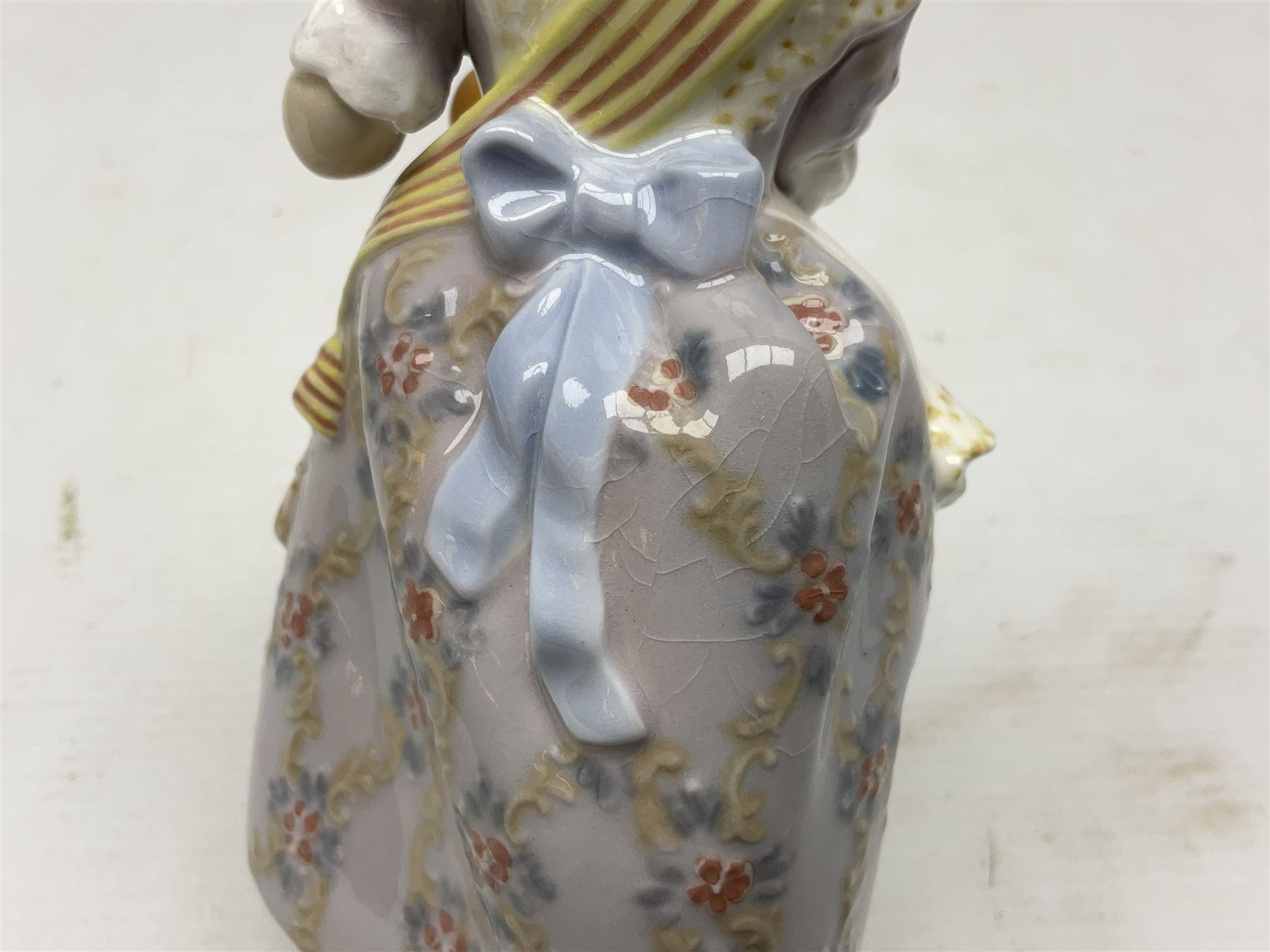 Lladro figure, Miss Valencia, modelled in traditional Valencian dress with basket of oranges, sculpted by Juan Huerta, with original box, no 1422, year issued 1982, year retired 1997, H18cm