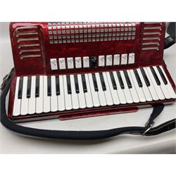 Clinkscale Crucianelli piano accordion in red pearline case with one-hundred and twenty buttons and forty-one keys L52cm; in carrying case