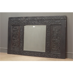  19th century carved oak panel with centre bevel edge mirror plate, decorated with lunettes, scrolls and foliage, W139cm, H87cm    