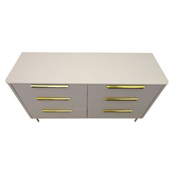 Made.com - 'Ebro' grey six drawer chest, gold painted metal shaped handles, rounded corners with fluted detail, raised on gold painted metal tapered supports