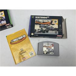 Nintendo 64 console, two controllers, games and accessories. Accessories to include the ‘Tremorpak’ and ‘Spook’ 2 Phono plugs and a S-VHS plug with adapter, both in original boxes. Games to include ‘Golden Eye 007’, ‘Doom 64’, ‘Killer Instinct Gold’, ‘Tetrisphere’, ‘F-1 World Grand Prix’, ‘Pilotwings 64’ and ‘Lylatwars’ with ‘Rumble Pak’, all with original boxes and instruction manuals. ‘Star Wars Episode I Racer’ game cartridge in Shadows of the Empire box. 