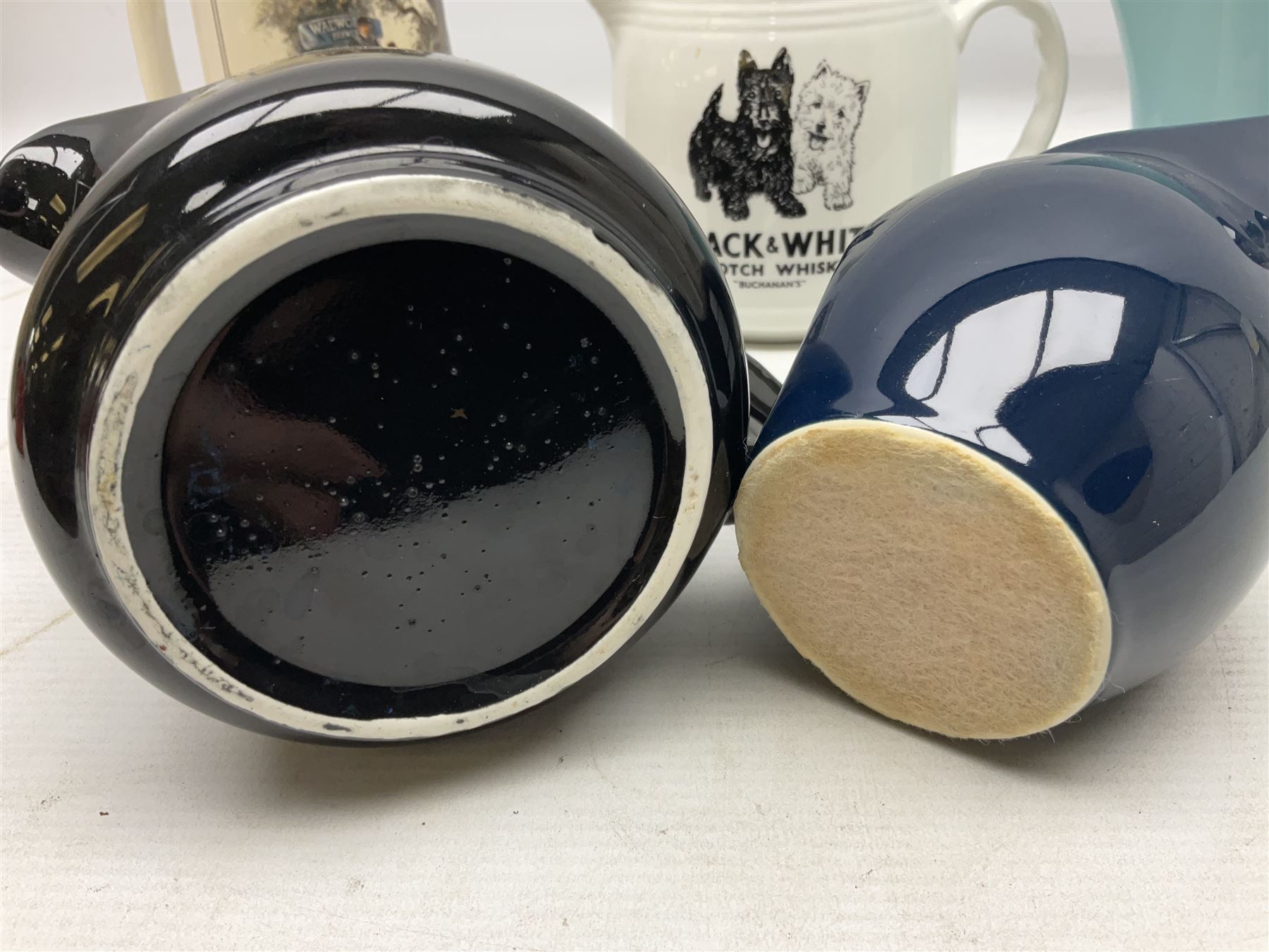 Six whisky water jugs, to include Wade Johnnie Walker, Haig, Black & White, etc