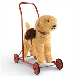 Push along toy dog, probably by Line Bros/Triang, plush dog upon red metal base with rubbe...