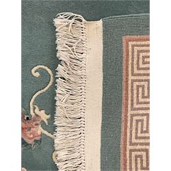 Chinese jade ground woollen rug decorated with dragons 