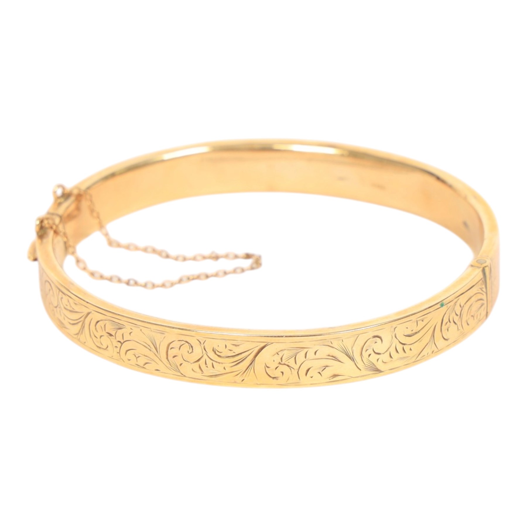 9ct gold hinged bangle, with engraved foliate decoration, hallmarked