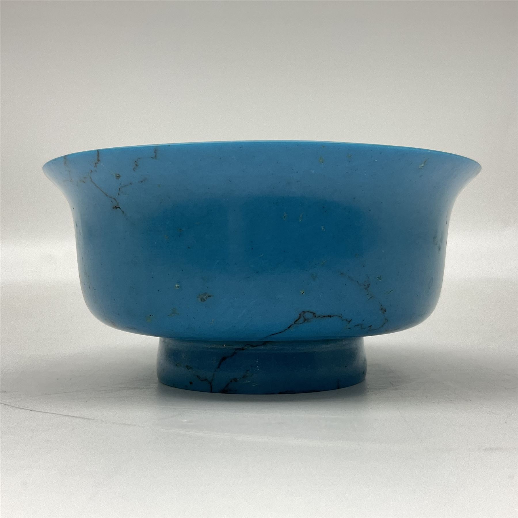Carved single piece turquoise bowl with fluted rim, upon a raised footed base, D10cm, H5cm