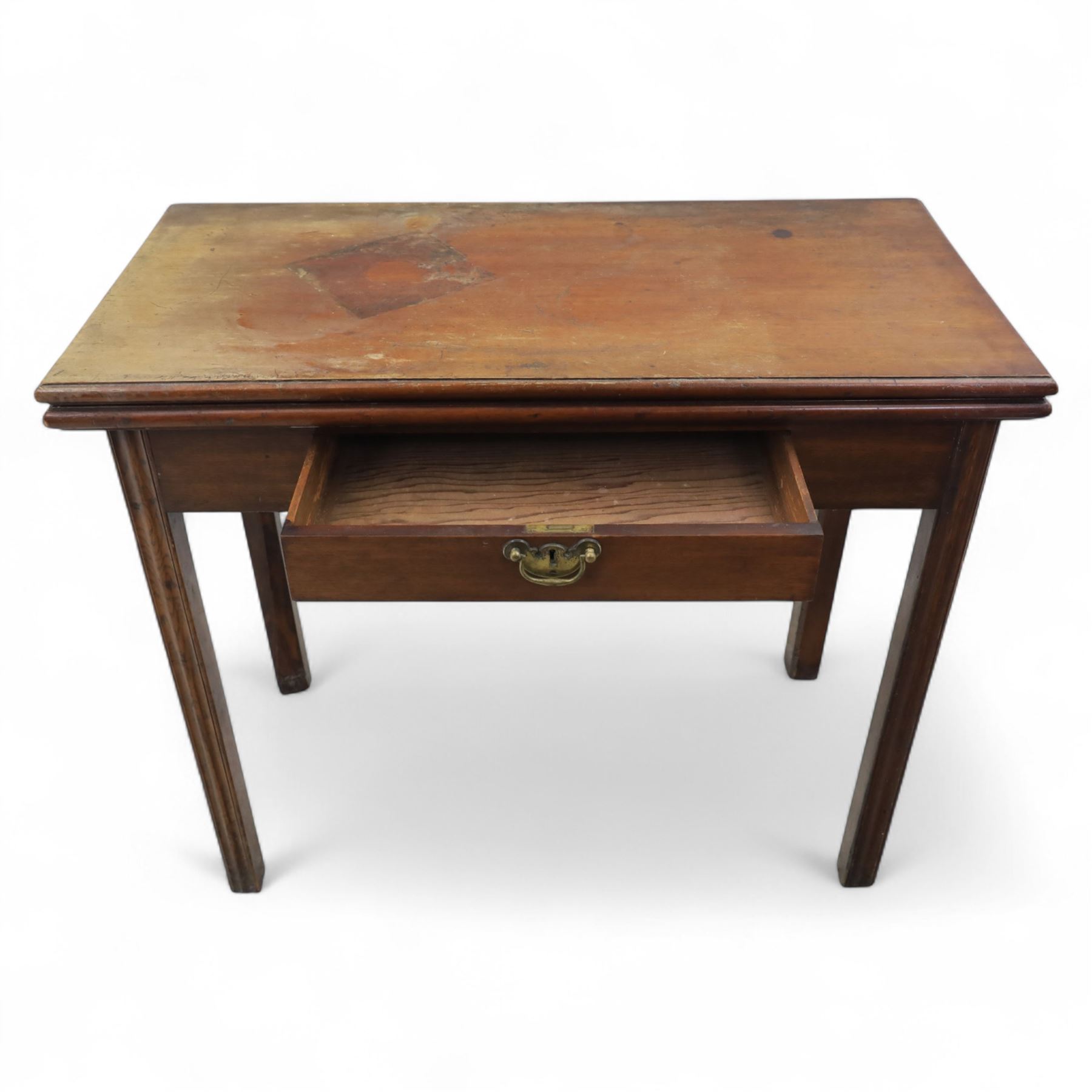 Georgian mahogany fold-over tea table, rectangular top with moulded edge over single frieze drawer with brass handle plate, on square tapering supports with gateleg