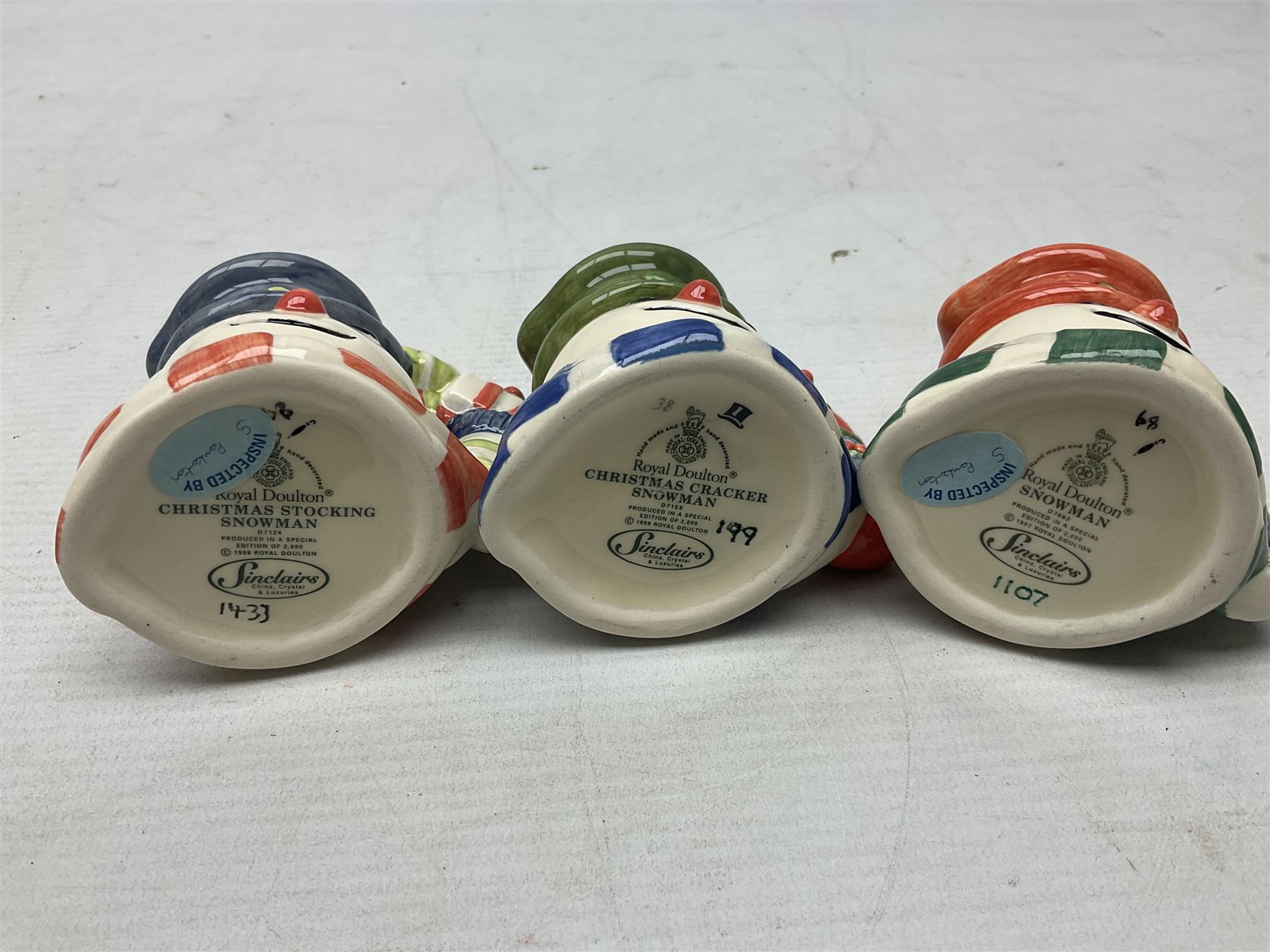 Three Royal Doulton The Mickey Mouse Collection figurines comprising Mickey Mouse MM1, Minnie Mouse MM2, and Goofy MM5, together withe three Royal Doulton limited edition miniature snowman character jugs comprising Christmas Stocking Snowman D7124, Christmas Cracker Snowman D7158 and Snowman D7062, all with original boxes 