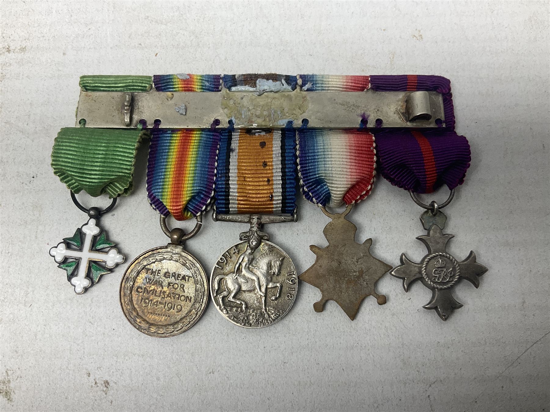 Three miniature groups of five medals - OBE Military group with WW1 trio and Italy Order of Saints Maurice & Lazarus Knights Cross; MBE Military group with WW2 trio and Territorial Efficiency Decoration; and WW2 trio, General Service Medal 1918-62 with Brunei and Arabian Peninsula clasps and GSM 1962 with Borneo clasp; all with ribbons on pinned wearing bars (3)