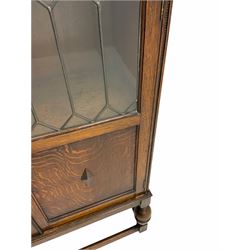 Early 20th century oak bookcase, fitted with two lead glazed doors