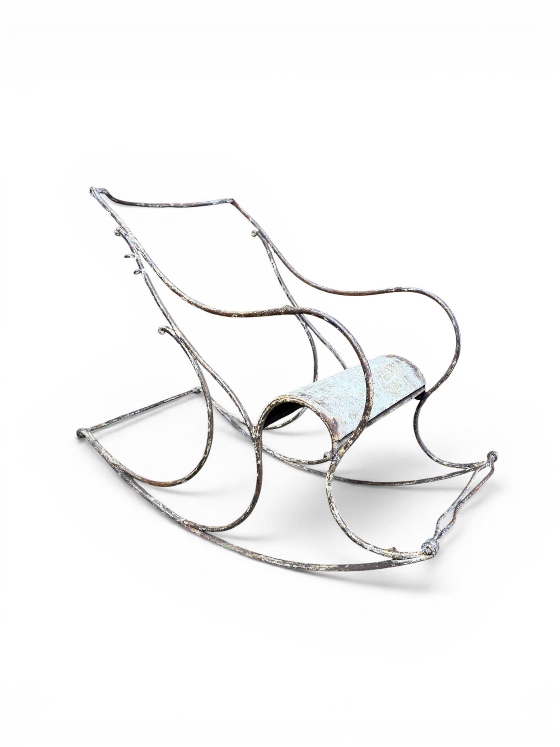 Pair of large unusual 19th century wrought iron garden rocking chairs, simple scroll design, lacking canvas seat