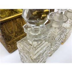 19th century brass repoussé perfume box, the ornately decorated casket with hinged domed cover lifting to reveal gold velvet lined interior containing three glass scent bottles, H14cm W15cm D7cm