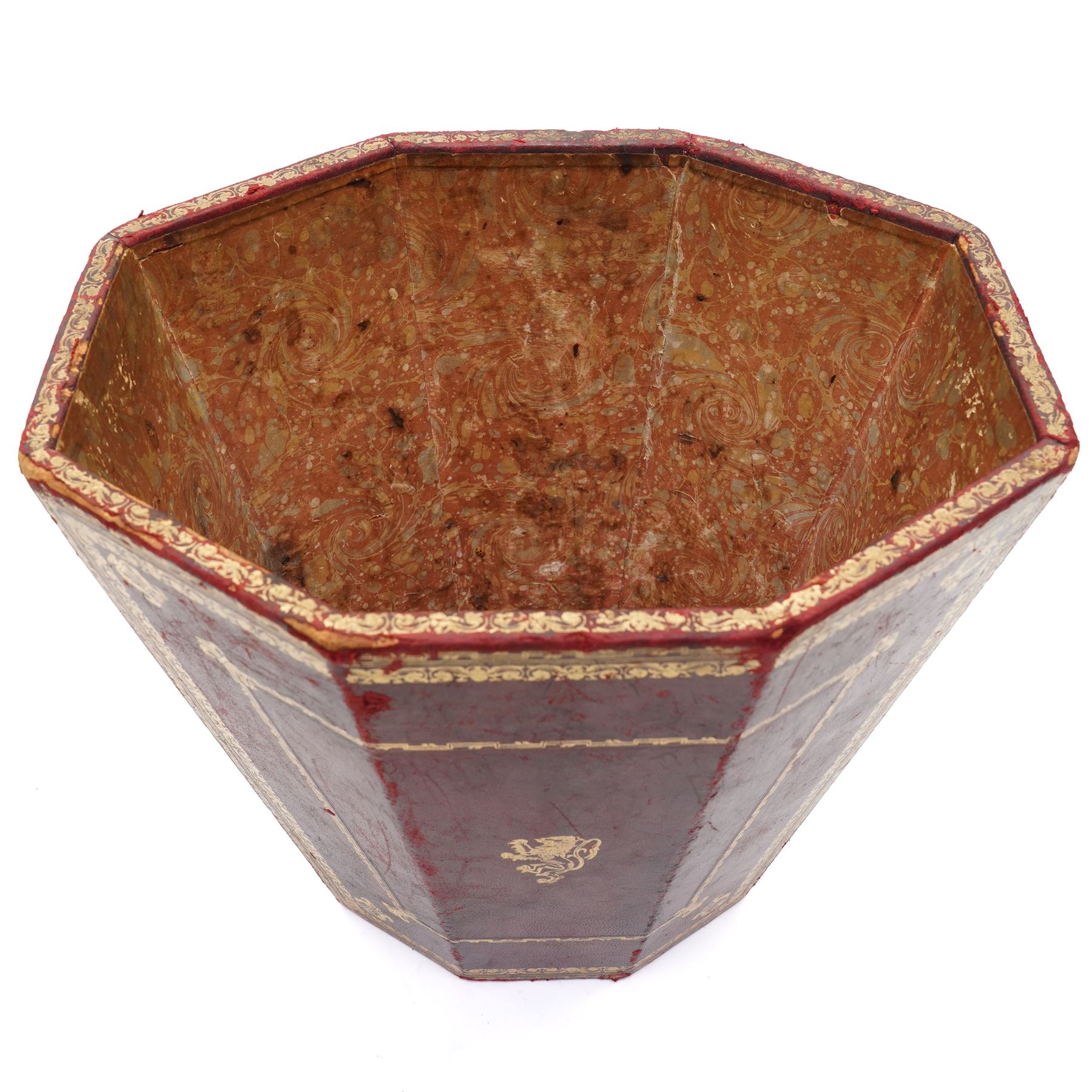 Regency style burgundy leather waste paper bucket of tapering octagonal form with gilt-tooled borders, sides fitted with lion mask ring handles, interior lined with marbled paper, circa 1900