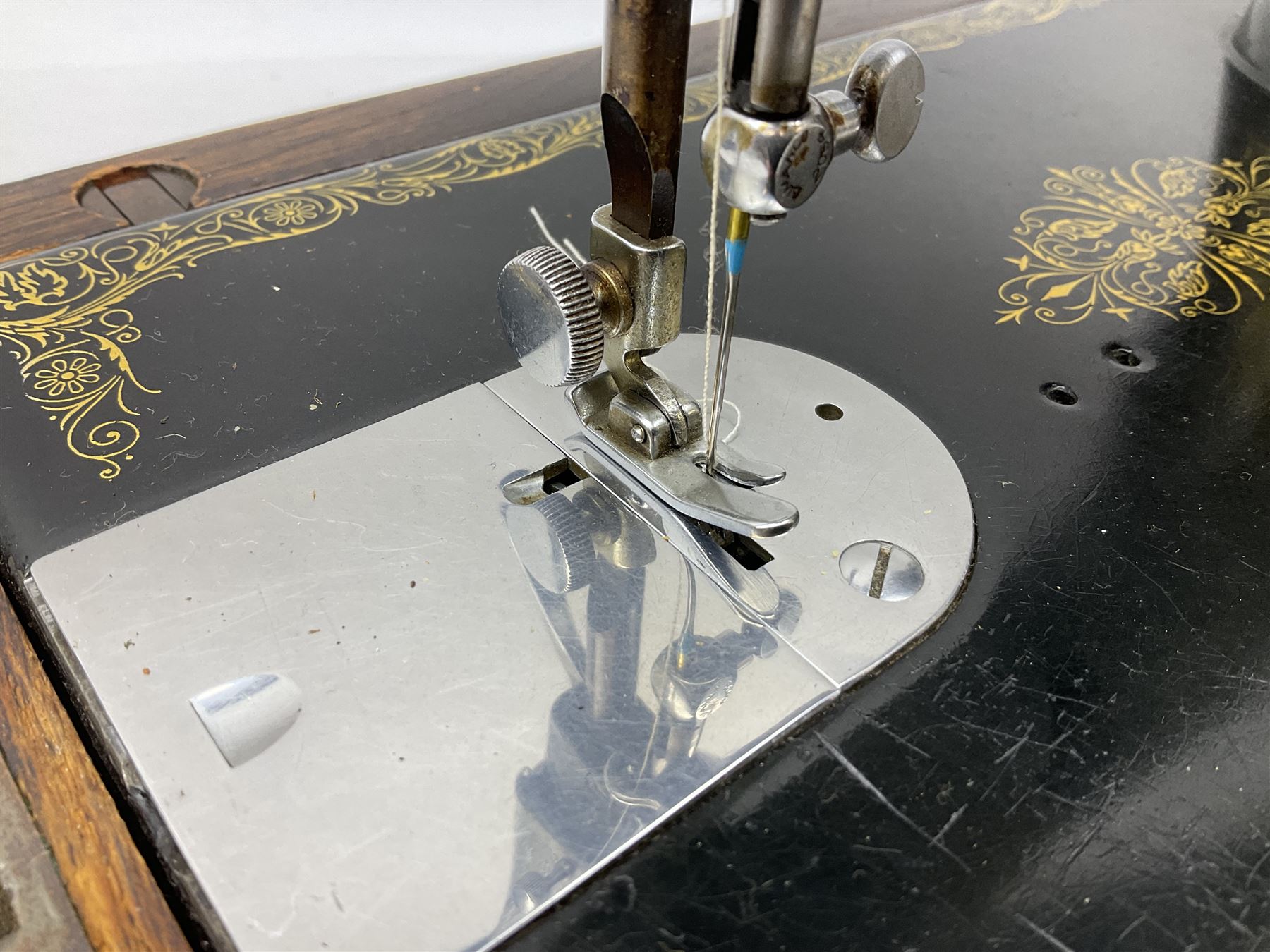 Singer sewing machine no. EA584046 in case (missing key) and Singer Manual of Family Sewing Machines