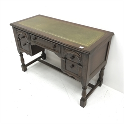 Mid 20th century oak writing desk, green leather inset top, five drawers, baluster supports joined by stretcher, W114cm, H76cm, D52cm