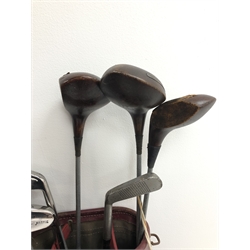  Eleven steel shafted golf clubs by Smithson Dewsbury G.C. etc comprising three woods and eight irons, together with two John Letters putters - 'Golden Goose' and 'Silver Swan' - in two carry bags with balls, head-covers etc  