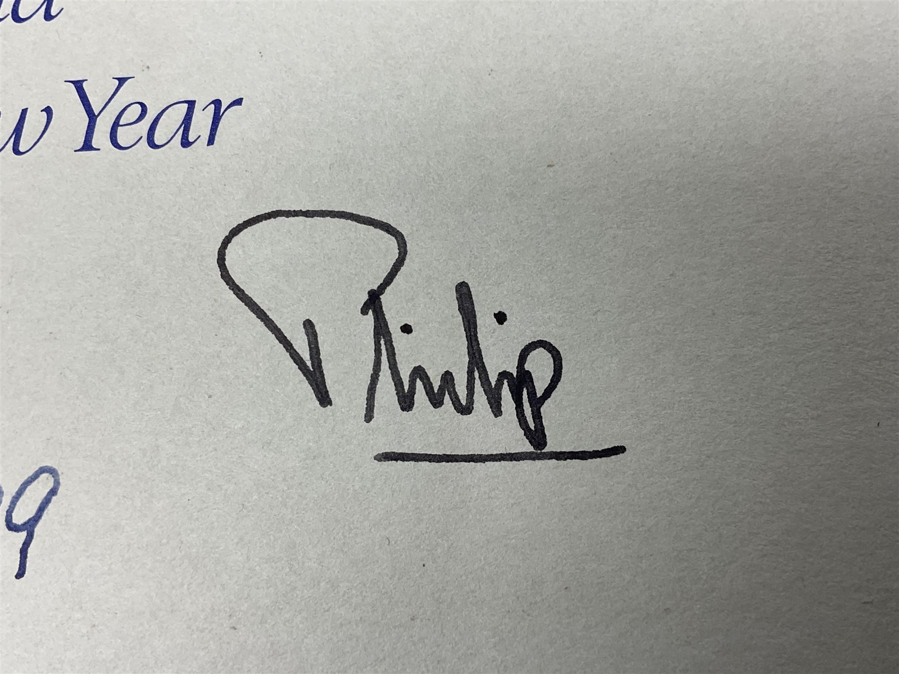 H.M. Queen Elizabeth II and HRH The Duke of Edinburgh, signed 1979 Christmas card with twin gilt ciphers to cover, colour photographic print of the Royal family standing in a garden, signed ‘Elizabeth R and Philip’ with manuscript date 1979 below