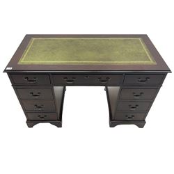 Georgian style mahogany twin pedestal desk, fitted with nine drawers, inset green tooled leather top