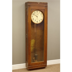  20th century International Time Recording Co. Model 13-7 Electric slave clock, No.10277, circular white Arabic dial with subsidiary seconds, in oak case with glazed door, with pendulum, H161cm, W52cm, D25cm  