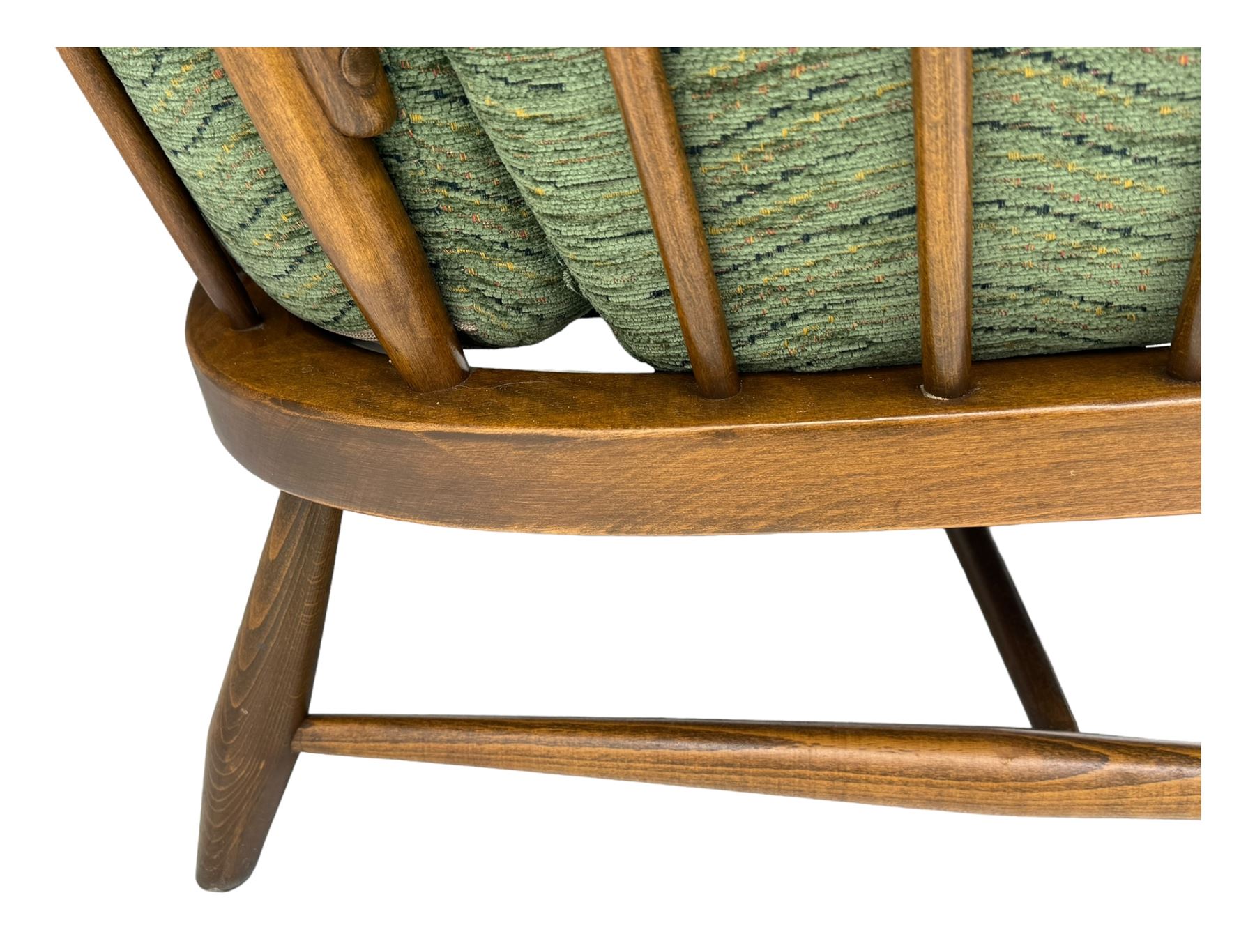 Ercol - mid-20th century three-piece suite, comprising two-seater sofa, upholstered in green fabric with teak frame, on splayed supports with stretcher (W142cm, D95cm, H87cm); with matching pair of armchairs (W82cm, D95cm, H87cm)