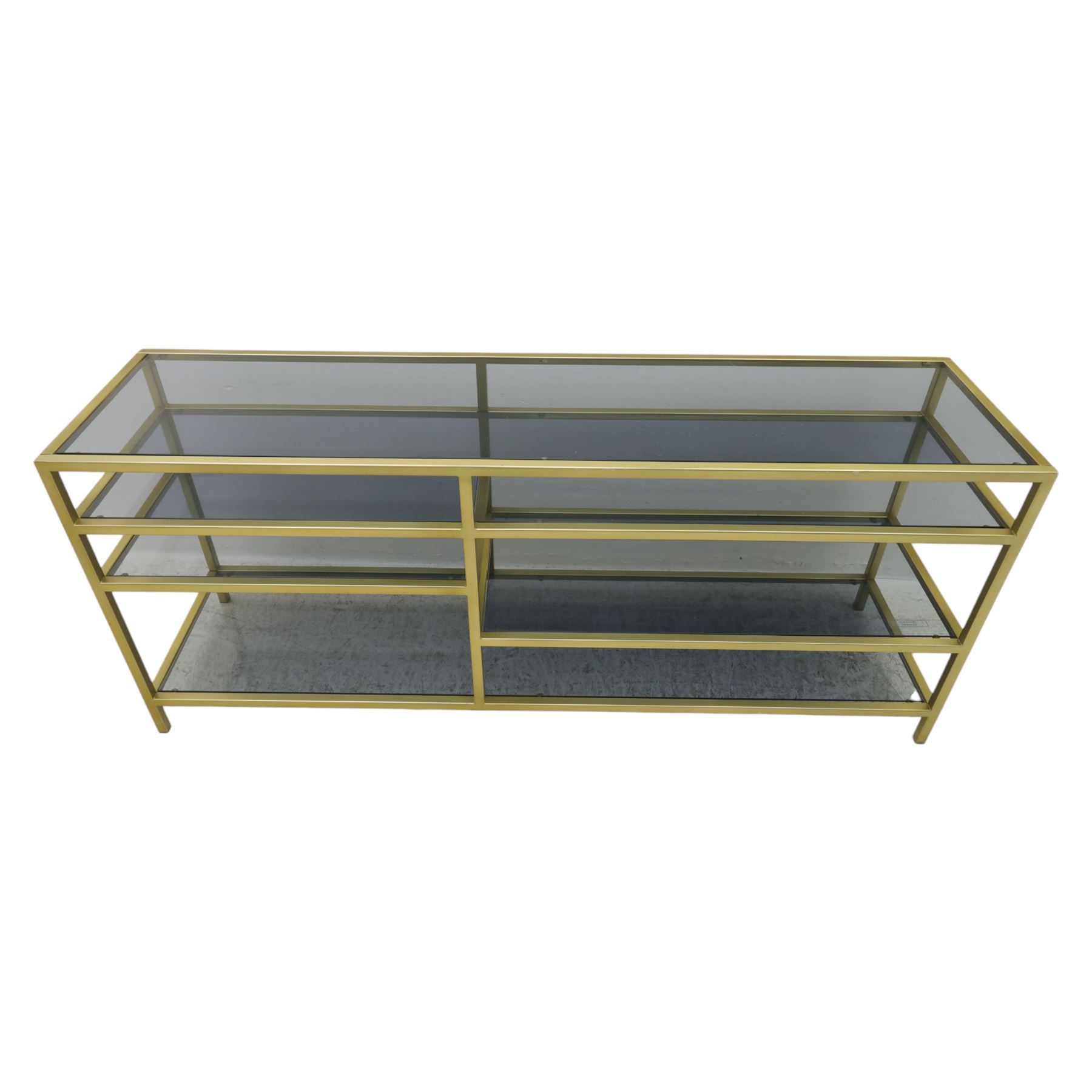 Modern glass and gilt metal media stand, rectangular smoked glass top panel set within a gilt finished metal surround, raised on square section legs, the underside fitted with a full-width glass shelf