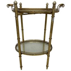 Gilt metal oval stand, two mirrored tray tiers with raised pierced galleries