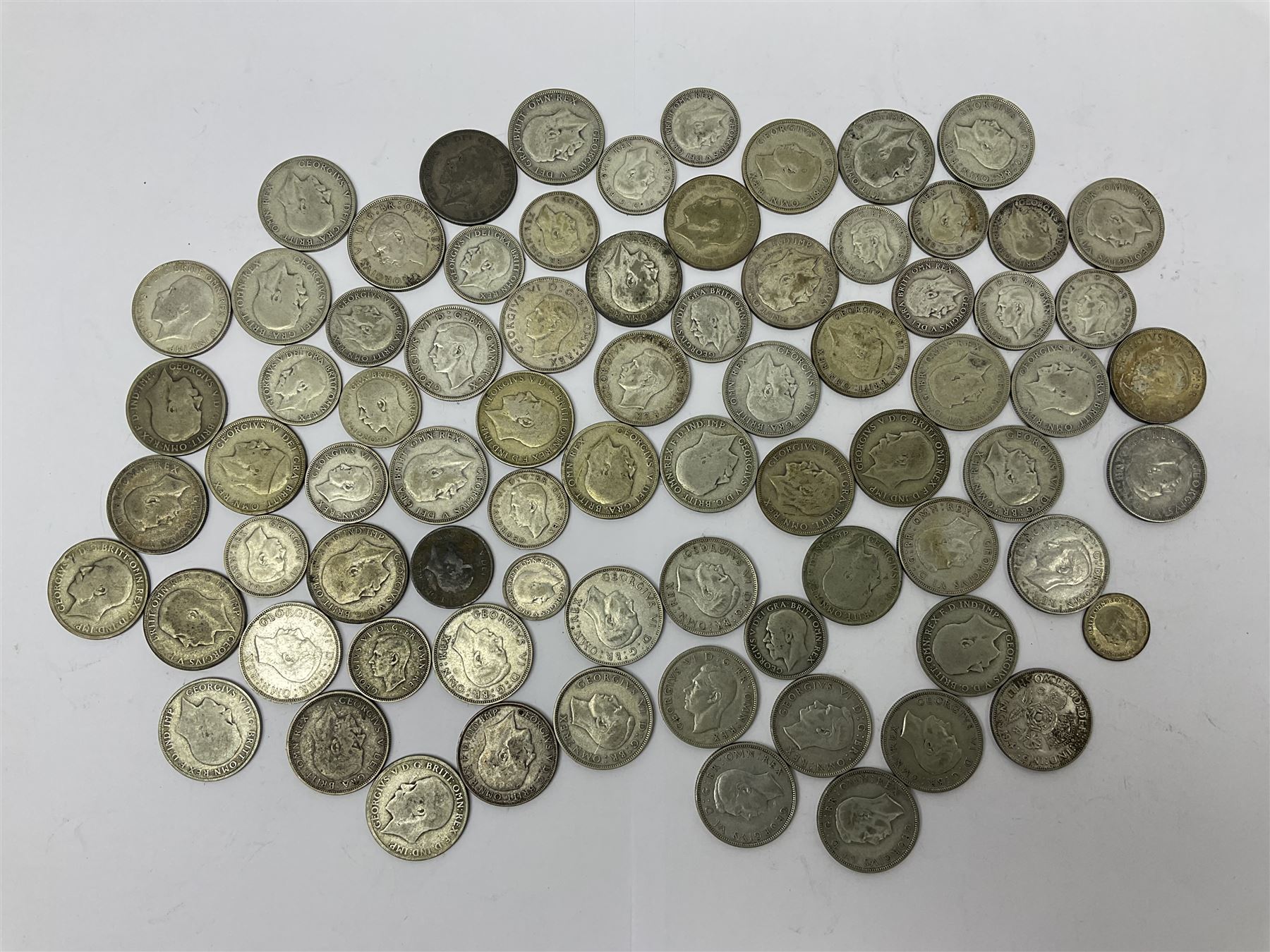 Approximately 710 grams of Great British pre 1947 silver coins, including one florins, one shillings and sixpence pieces 