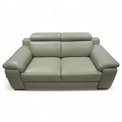 Modern Italian style leather two-seat sofa, upholstered in pale grey leather with panel stitched cushioning, with retractable head rests and broad arms, raised on square feet