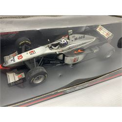 Four Minichamps 1:18 scale die-cast racing cars - Williams F1 Team BMW FW26 R. Schumacher; McLaren Mercedes MP4-12 D. Coulthard; McLaren Mercedes MP4-13 M. Hakkinen; and Formel 1 Jordan peugeot EJR 195 E. Irvine; all boxed (4)