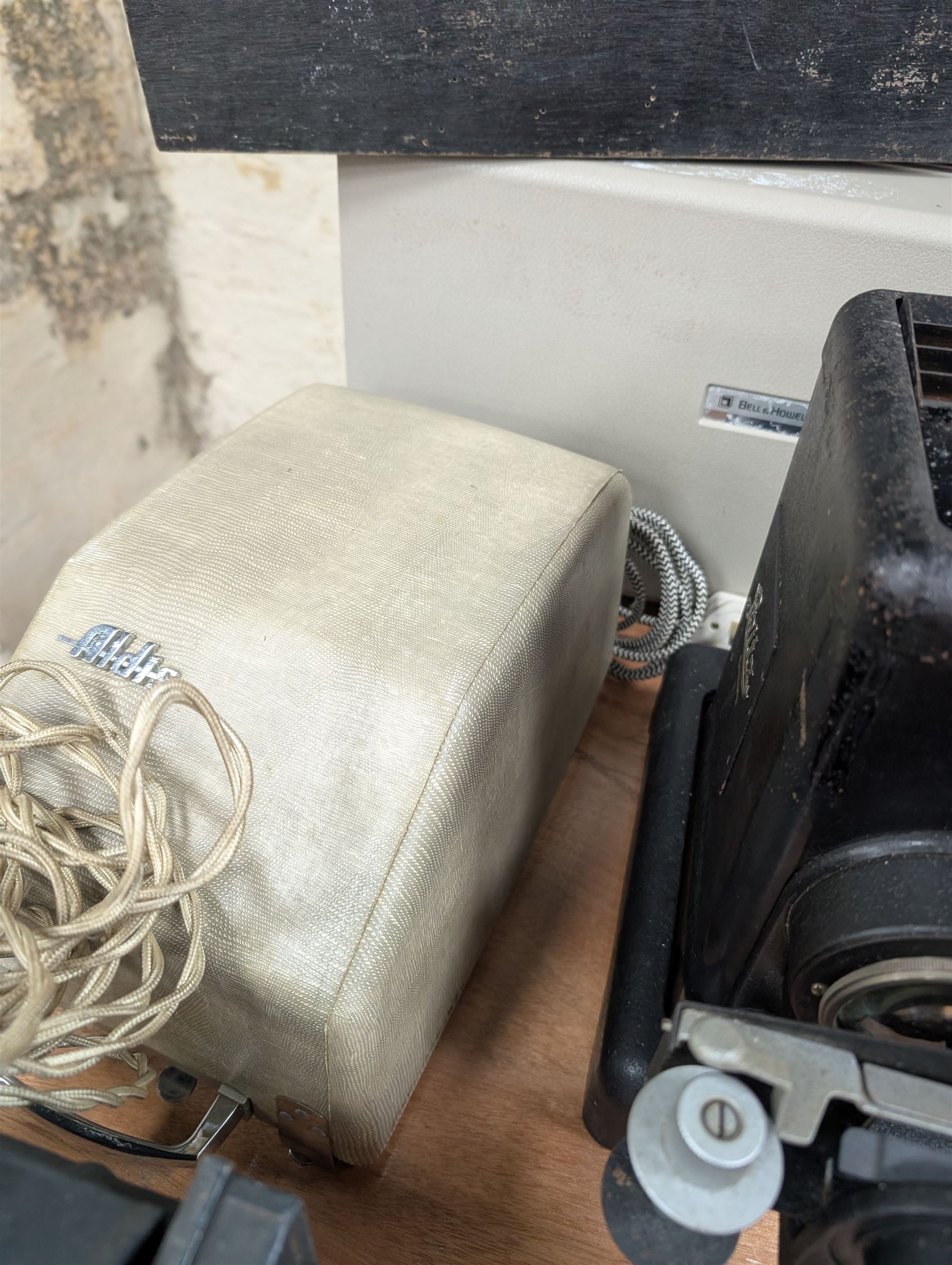 Ten vintage projectors, including Bell & Howell 1623x, Kershaw Daylight Strip projector, Aldis, Leitz, Pathoscope Ace, Ray Safety Cinema, Baby Projector and Pullin Optics