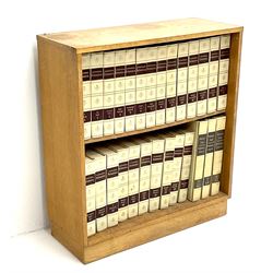 Light oak bookcase with Encylopedia Britania
