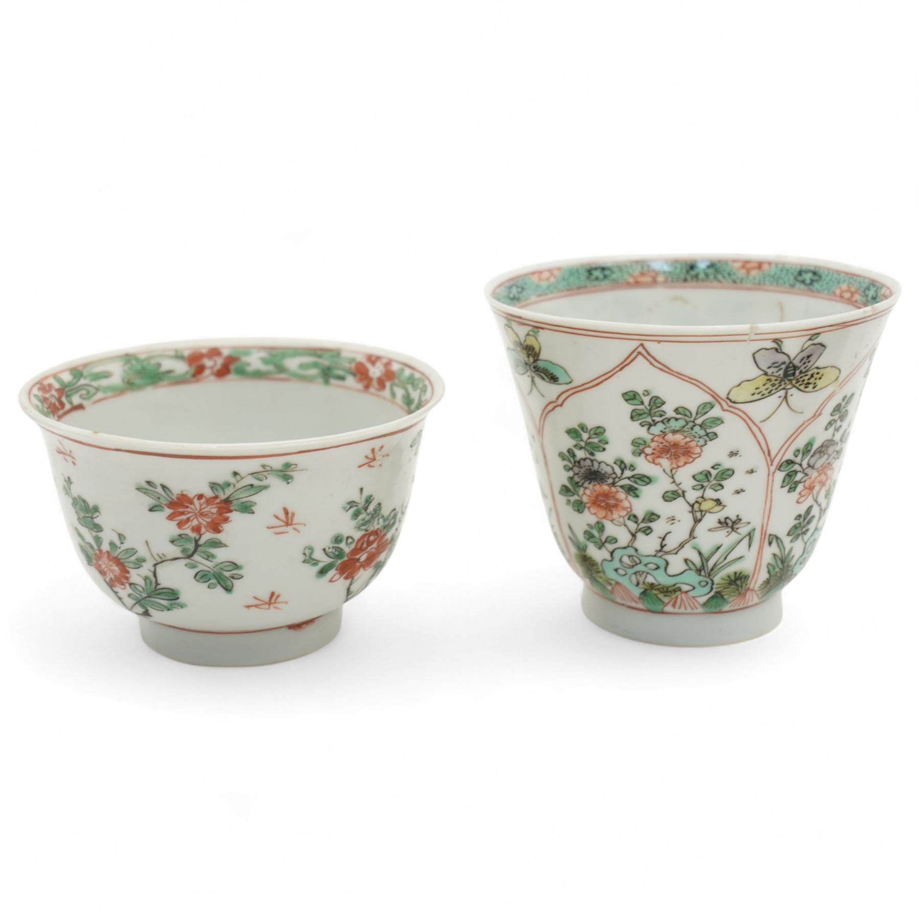 Three Chinese famille verte examples, approximately Yongzheng period, to include two teabowls and two saucers, each decorated with flowers and butterflies, two with sacred fungus mark within double rings, the teabowl with lotus mark, the other indistinct - possibly a Wan mark within lozenge (4)