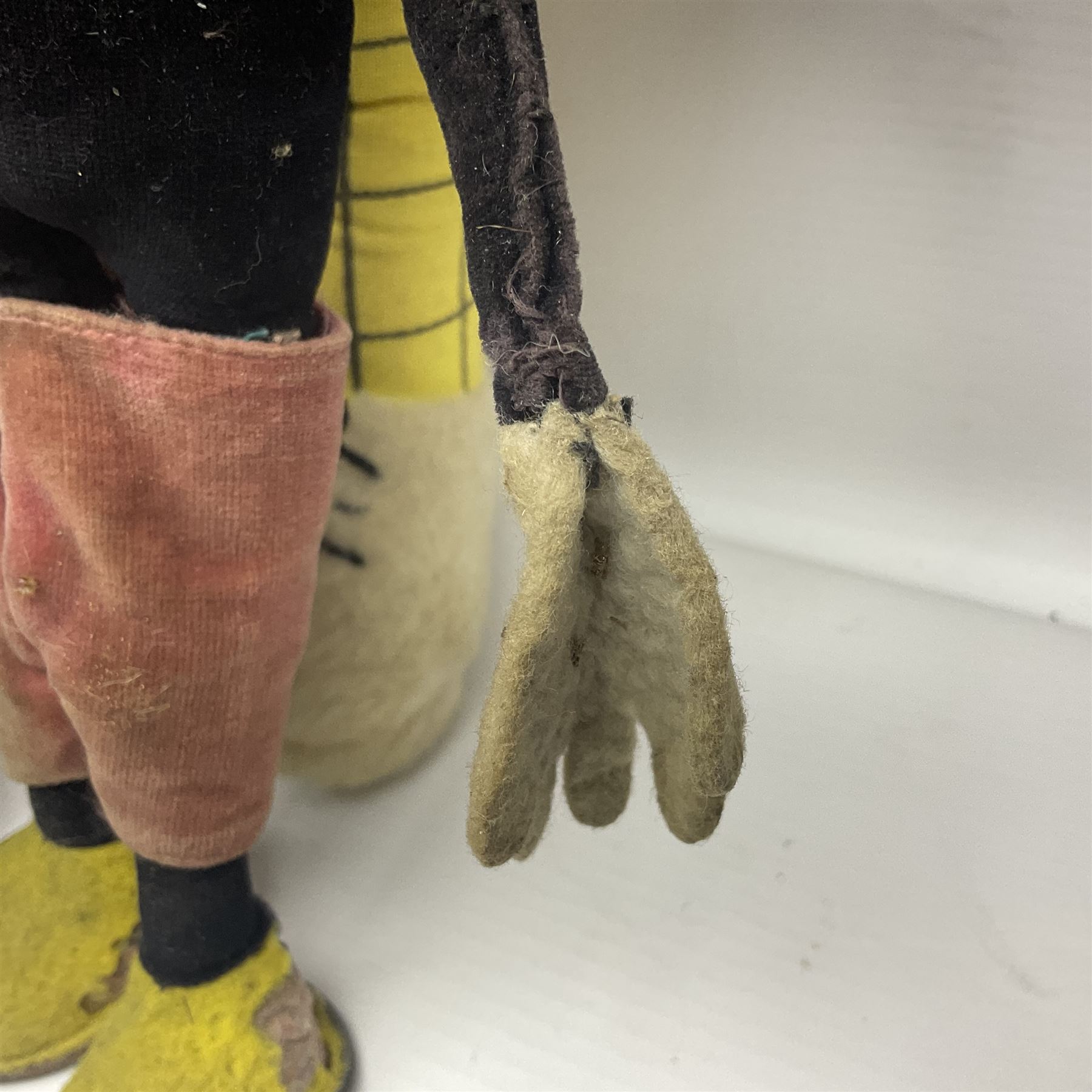 Deans Rag Book Mickey Mouse soft toy, circa 1930's, black velveteen head and body, with cream face and hands, red shorts and yellow felt shoes with leather soles, marked Reg. No. 750811 to neck H20cm; mid-20th century woodwool filled plush covered teddy bear with revolving head, applied eyes, vertically stitched nose and mouth and jointed limbs H52cm; soft toy figure of Rupert Bear; and Japanese clockwork tin-plate and plush covered mechanical toy of a gnome riding a donkey (4)