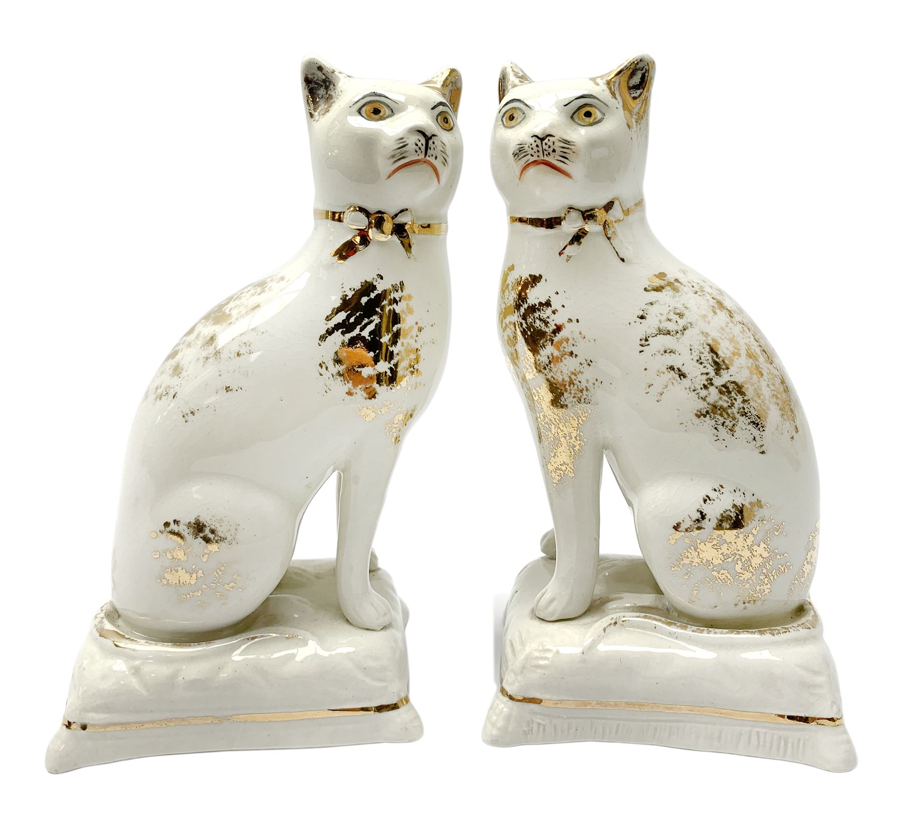 Pair of Victorian Staffordshire cats, modelled seated upon cushions, with gilt detail throughout, H18cm