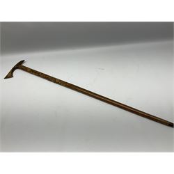 Cast iron walking stick stand, in the manner of Coalbrook, together with five walking sticks, to include horn handled example with ebonised cane and silver collar hallmarked Birmingham 1929, blackthorn example, etc. 