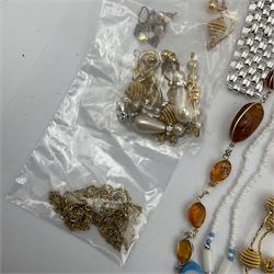 Large collection of costume jewellery including amber beads, rose quartz necklace, brooches, bracelets and necklaces