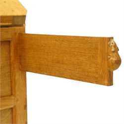 Mouseman - oak adzed bureau, fall front with carved mouse lopers, with fitted interior, above two short over two long drawers, by the workshop of Robert Thompson of Kilburn
